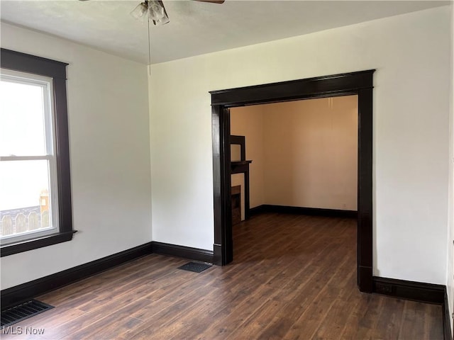 3039 W St, Weirton, WV 26062 - spare room with healthy amount of natural light, ceiling fan, and dark wood-style floors