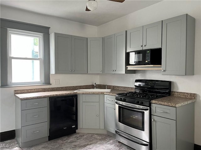 3039 W St, Weirton, WV 26062 - kitchen featuring black appliances, gray cabinetry, a sink, and dark countertops