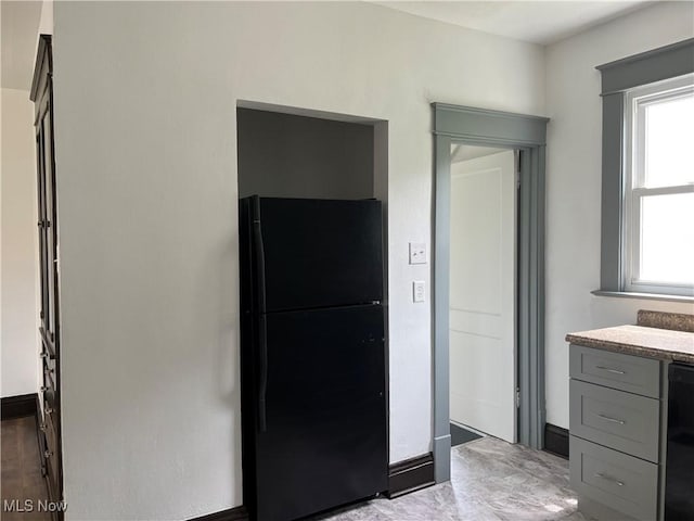 3039 W St, Weirton, WV 26062 - kitchen with freestanding refrigerator, gray cabinetry, light countertops, and baseboards
