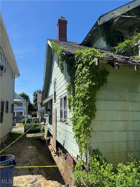 view of home's exterior featuring a chimney