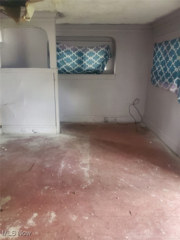 1239 E 143rd St, East Cleveland, OH 44112 - unfurnished room featuring baseboards and unfinished concrete floors