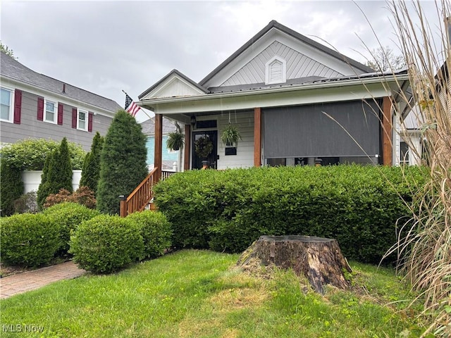 1726 Covert St, Parkersburg, WV 26101 - view of front of property with metal roof, a front lawn, and covered porch
