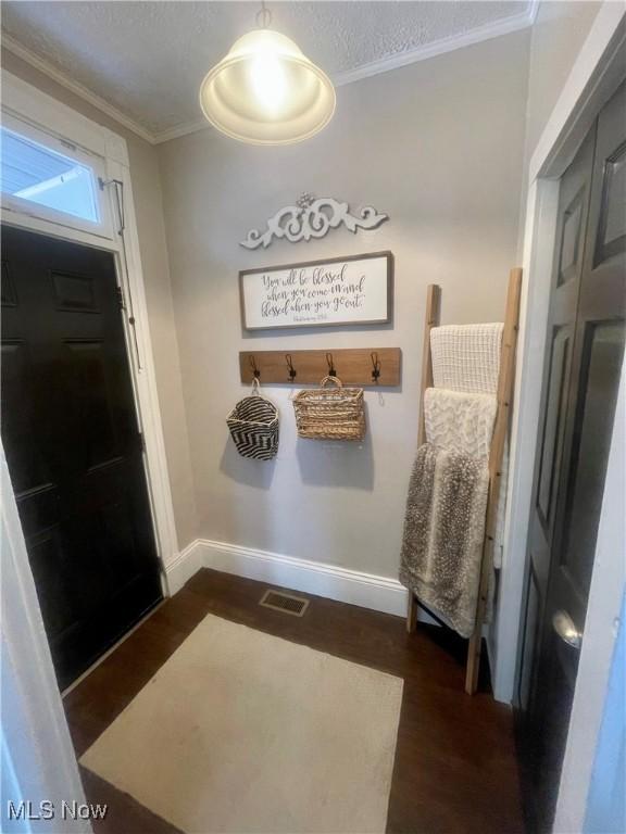 1726 Covert St, Parkersburg, WV 26101 - mudroom with baseboards, dark wood-style floors, and ornamental molding