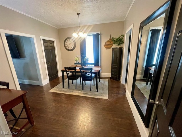 1726 Covert St, Parkersburg, WV 26101 - dining space featuring a textured ceiling, crown molding, dark wood-style floors, a chandelier, and baseboards