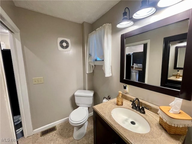 1726 Covert St, Parkersburg, WV 26101 - bathroom featuring baseboards, toilet, and vanity