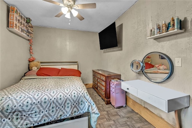 2212 Randall St, Lorain, OH 44052 - bedroom with a textured wall and a ceiling fan