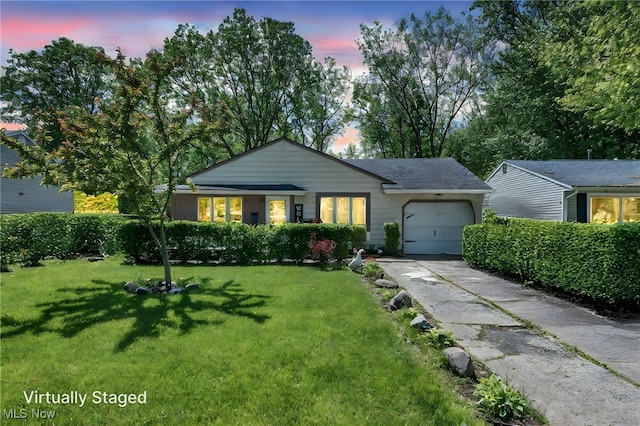 2212 Randall St, Lorain, OH 44052 - single story home featuring an attached garage, a front yard, and concrete driveway