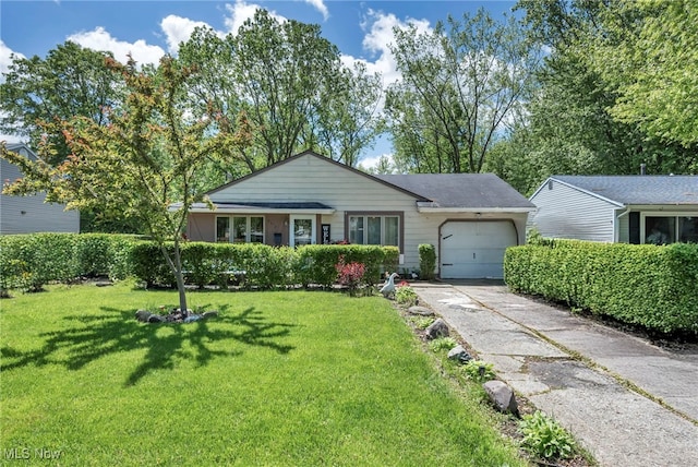2212 Randall St, Lorain, OH 44052 - single story home with an attached garage, a front yard, and driveway