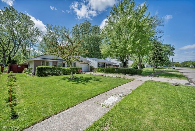 2212 Randall St, Lorain, OH 44052 - view of front of property featuring a garage and concrete driveway
