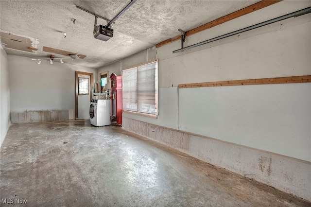2212 Randall St, Lorain, OH 44052 - garage with washer / clothes dryer and a garage door opener