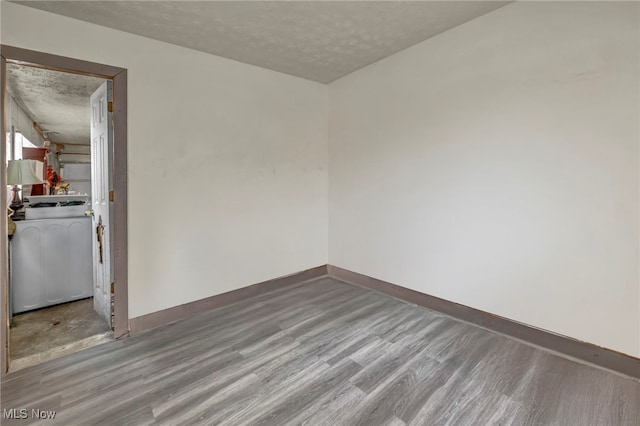 2212 Randall St, Lorain, OH 44052 - empty room featuring a textured ceiling, wood finished floors, and baseboards