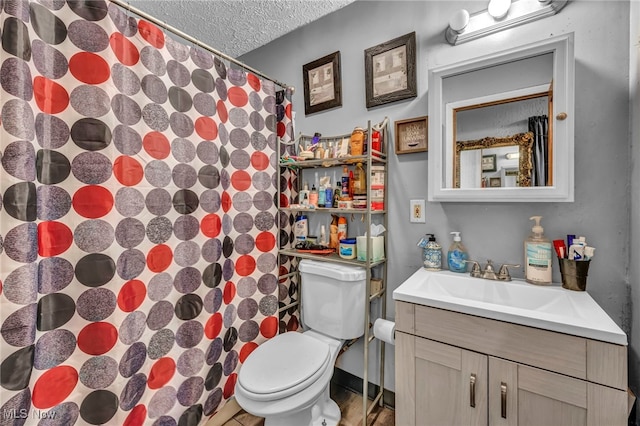2212 Randall St, Lorain, OH 44052 - bathroom featuring toilet, a textured ceiling, vanity, and a shower with shower curtain