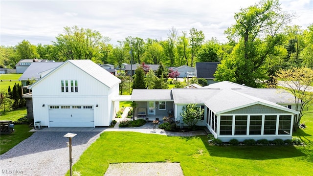7214 Ridge Ave, Conneaut, OH 44030 - view of front of house with driveway and a front lawn
