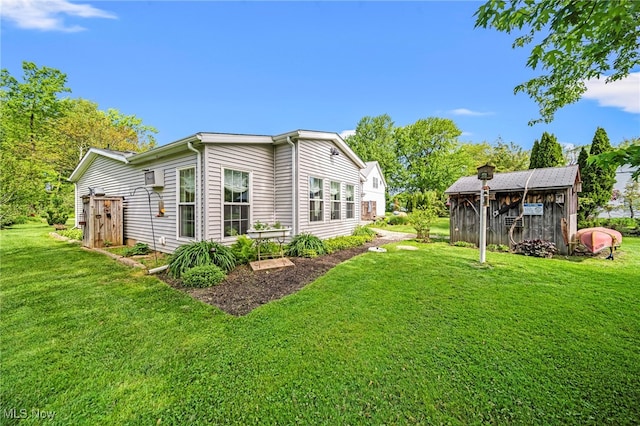 7214 Ridge Ave, Conneaut, OH 44030 - rear view of house featuring a lawn