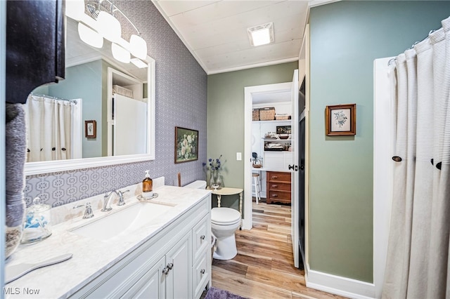 7214 Ridge Ave, Conneaut, OH 44030 - bathroom with wood finished floors, crown molding, wallpapered walls, vanity, and toilet