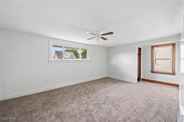 494 W Columbia St, Alliance, OH 44601 - carpeted spare room featuring ceiling fan and baseboards