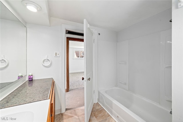 494 W Columbia St, Alliance, OH 44601 - bathroom featuring vanity, baseboards, and bathing tub / shower combination