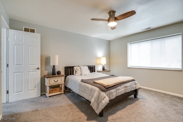 carpeted bedroom featuring a ceiling fan and baseboards
