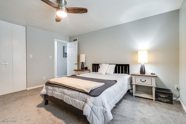 bedroom with carpet floors, a ceiling fan, and baseboards