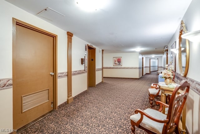corridor featuring carpet flooring
