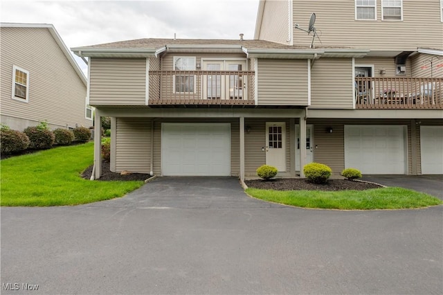 6957 Tippecanoe Rd, Canfield, OH 44406 - view of front facade with a balcony, driveway, a garage, and a front lawn