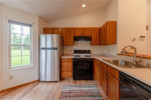 6957 Tippecanoe Rd, Canfield, OH 44406 - kitchen with range with gas cooktop, freestanding refrigerator, dishwasher, under cabinet range hood, and a sink