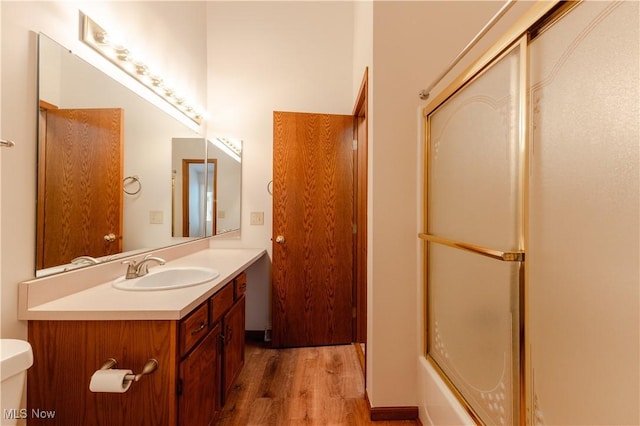 6957 Tippecanoe Rd, Canfield, OH 44406 - bathroom with wood finished floors, vanity, and toilet