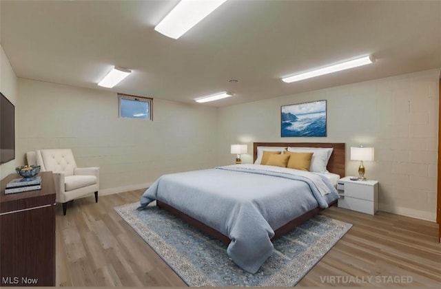 6957 Tippecanoe Rd, Canfield, OH 44406 - bedroom featuring light wood-style flooring and concrete block wall