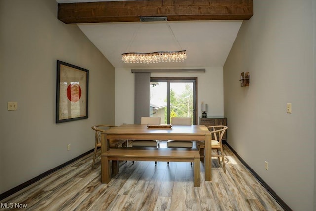 1367 Mockingbird Dr, Kent, OH 44240 - dining space featuring wood finished floors, a chandelier, and baseboards