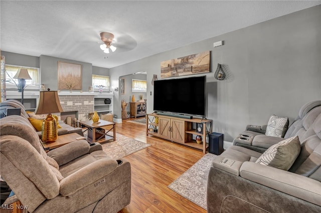 3403 Hartwood Rd, Cleveland Heights, OH 44112 - living room featuring light wood-style flooring, ceiling fan, and baseboards