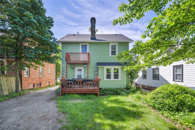3403 Hartwood Rd, Cleveland Heights, OH 44112 - back of house featuring a balcony, a chimney, roof with shingles, and a wooden deck