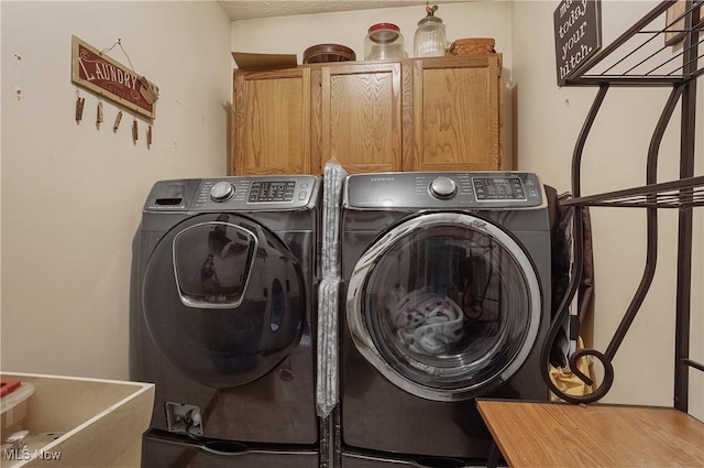 3277 Plainview Rd, Ravenna, OH 44266 - laundry area featuring cabinet space and independent washer and dryer