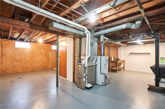 1658 Bronson Rd, Akron, OH 44305 - below grade area featuring water heater and wood walls