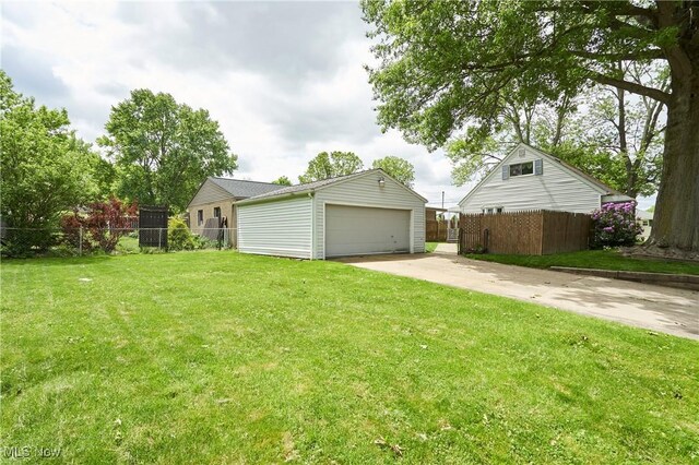 1658 Bronson Rd, Akron, OH 44305 - view of yard with a garage and an outbuilding