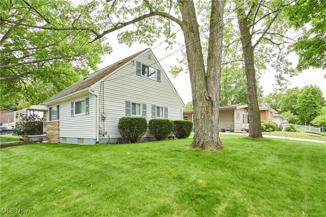 1658 Bronson Rd, Akron, OH 44305 - view of side of property with a yard