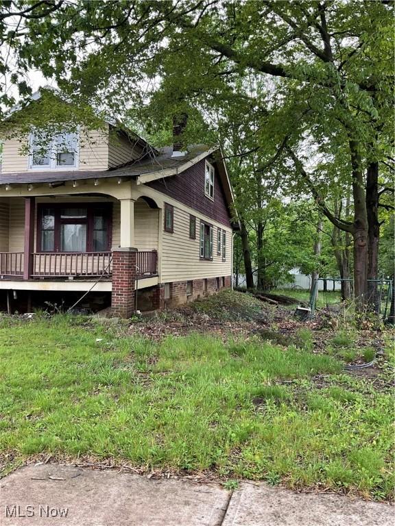 17205 Mapleboro Ave, Maple Heights, OH 44137 - view of side of home featuring a porch