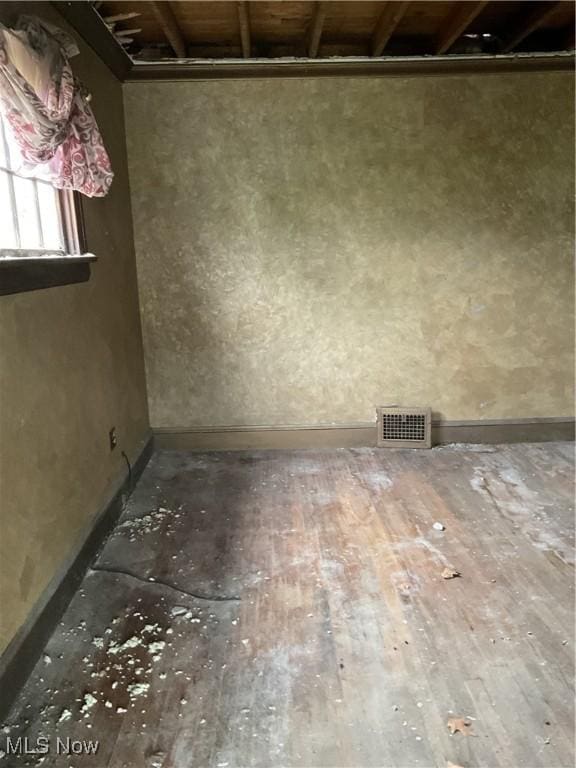 17205 Mapleboro Ave, Maple Heights, OH 44137 - unfurnished room featuring wood-type flooring and baseboards