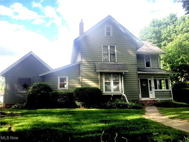 2775 Sr 9, Salem, OH 44460 - view of front of house featuring a chimney and a front lawn