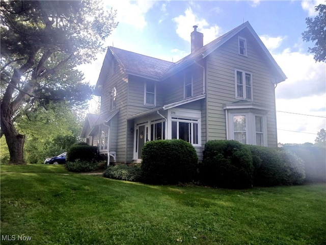 2775 Sr 9, Salem, OH 44460 - view of home's exterior with a chimney and a yard
