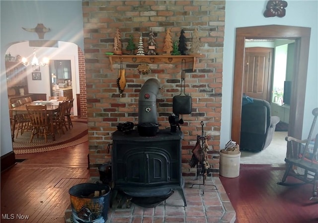 2775 Sr 9, Salem, OH 44460 - living area with hardwood / wood-style floors, a wood stove, and a chandelier