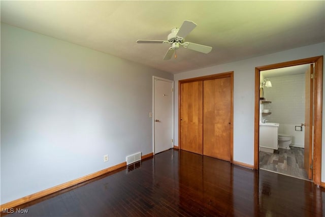 338 Applegrove St NE, North Canton, OH 44720 - unfurnished bedroom featuring a closet, wood finished floors, baseboards, and a ceiling fan