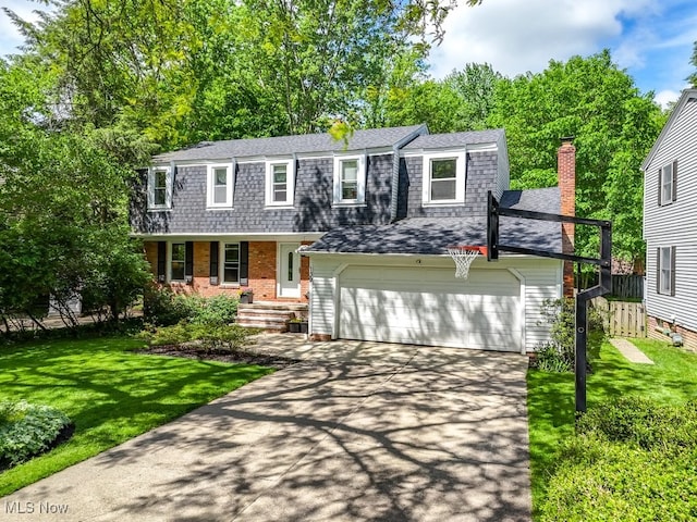 139 Elm Ct, Chagrin Falls, OH 44022 - colonial inspired home with a shingled roof, concrete driveway, a porch, and brick siding