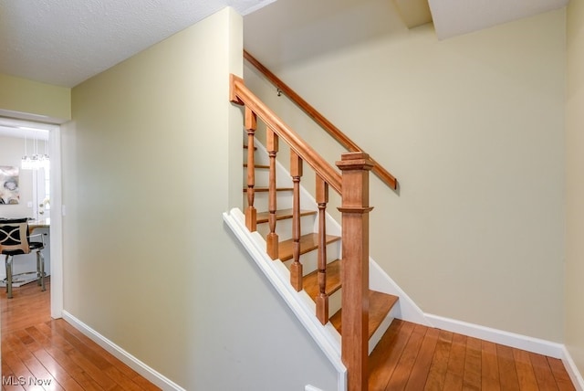 139 Elm Ct, Chagrin Falls, OH 44022 - stairs featuring wood-type flooring and baseboards