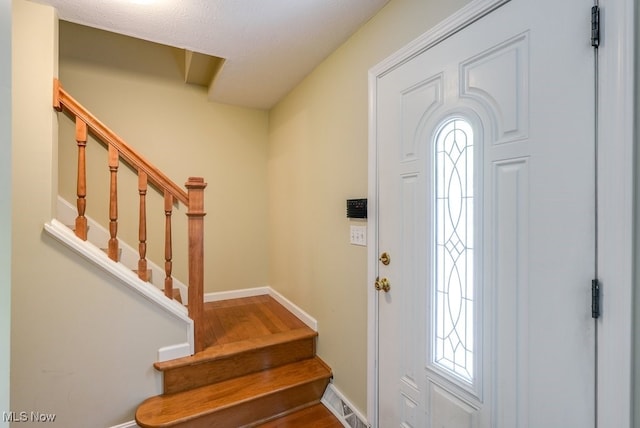139 Elm Ct, Chagrin Falls, OH 44022 - entryway featuring stairway, baseboards, plenty of natural light, and wood finished floors