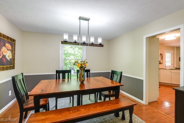139 Elm Ct, Chagrin Falls, OH 44022 - dining space with light wood-style flooring and baseboards