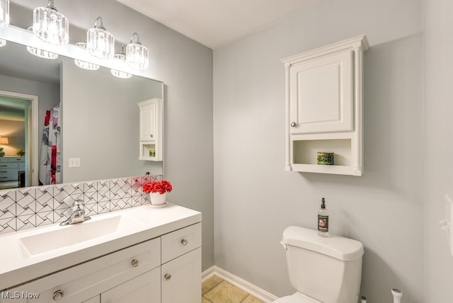 139 Elm Ct, Chagrin Falls, OH 44022 - bathroom with backsplash, toilet, tile patterned flooring, vanity, and baseboards