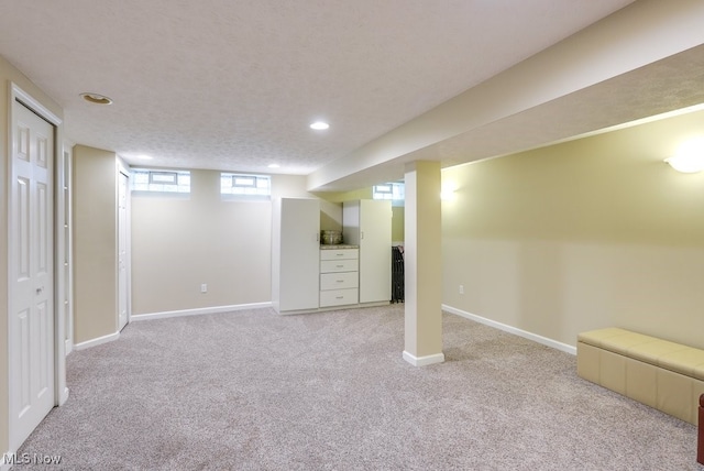 139 Elm Ct, Chagrin Falls, OH 44022 - below grade area with light carpet, recessed lighting, and baseboards
