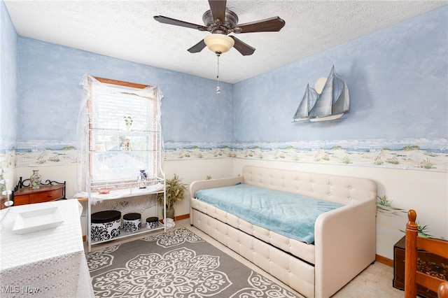 104 Joshua Dr, Rittman, OH 44270 - bedroom with wallpapered walls, a textured ceiling, a ceiling fan, and baseboards