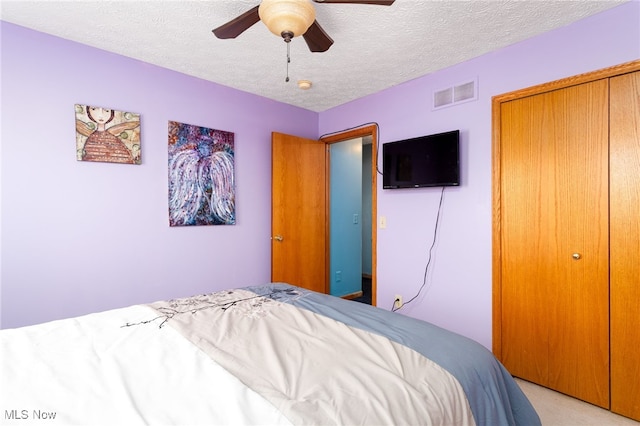 104 Joshua Dr, Rittman, OH 44270 - bedroom with a textured ceiling, a closet, light carpet, and ceiling fan