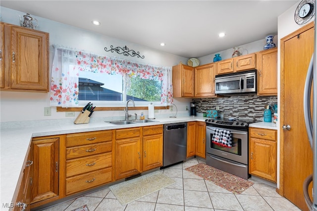 104 Joshua Dr, Rittman, OH 44270 - kitchen with stainless steel appliances, a sink, light countertops, tasteful backsplash, and recessed lighting